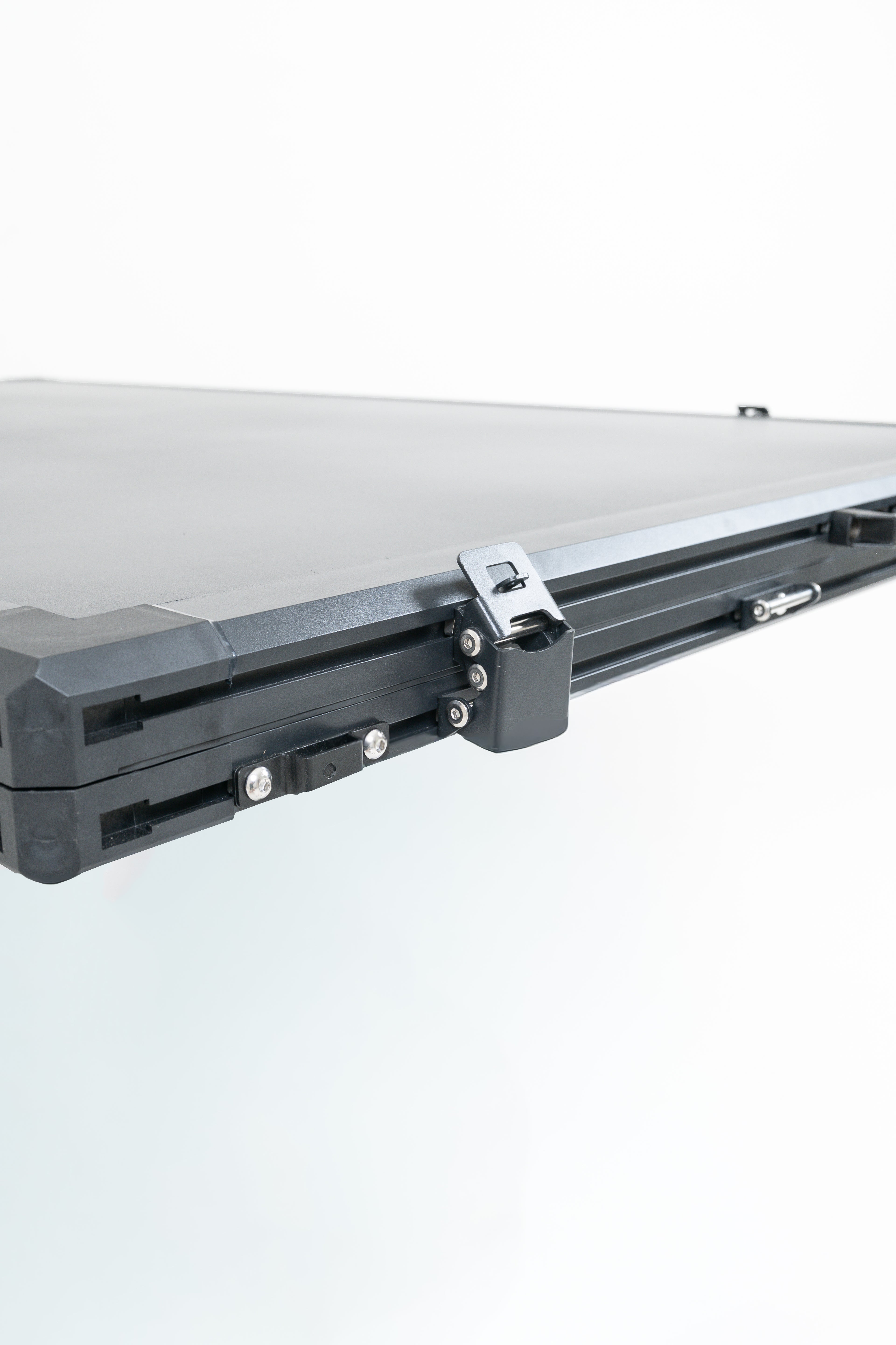 Close up of black rooftop tent on a white background