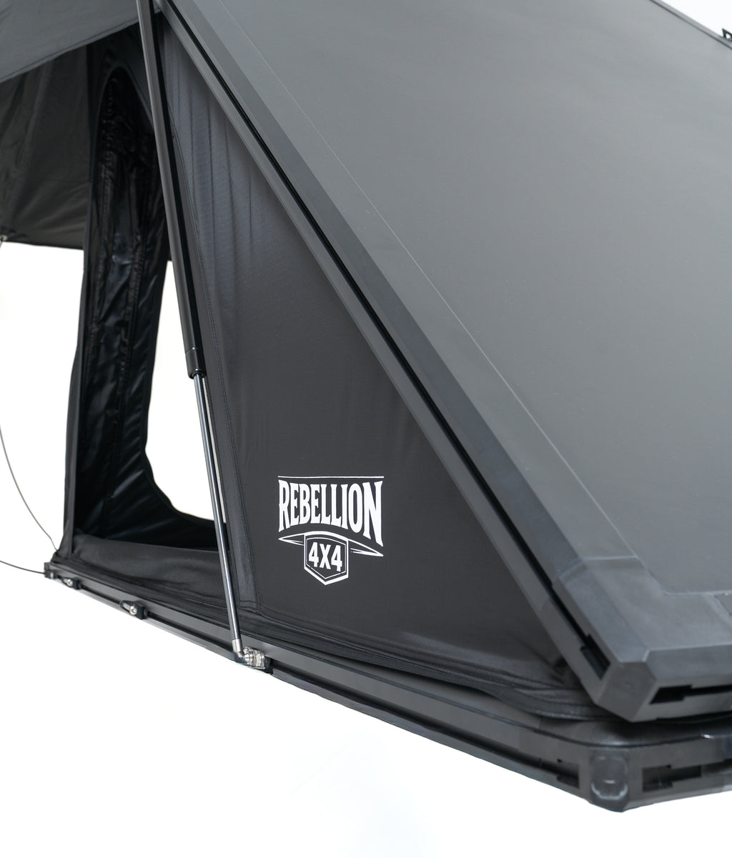 Gray rooftop tent with 'Rebellion 4x4' logo on a white background