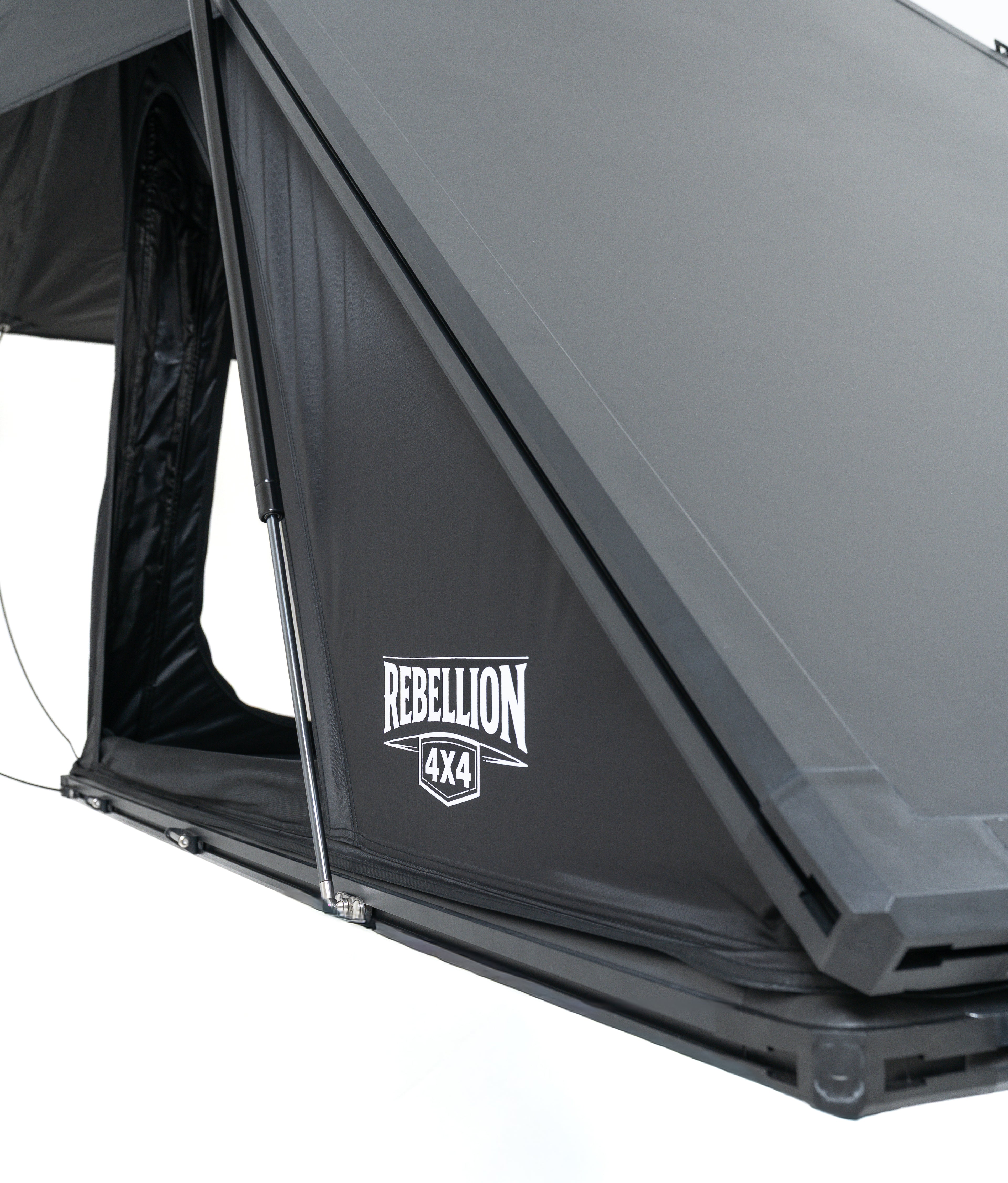 Gray rooftop tent with 'Rebellion 4x4' logo on a white background