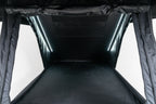 Black interior of a rebellion roof top tent opened