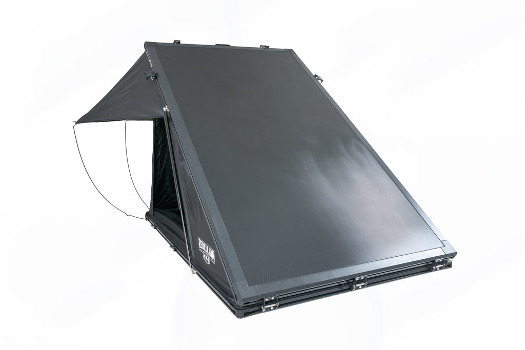 Black carbon roof top tent open in studio with white backround