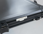 Black roof top tent with 'Rebellion 4x4' branding on a gray background